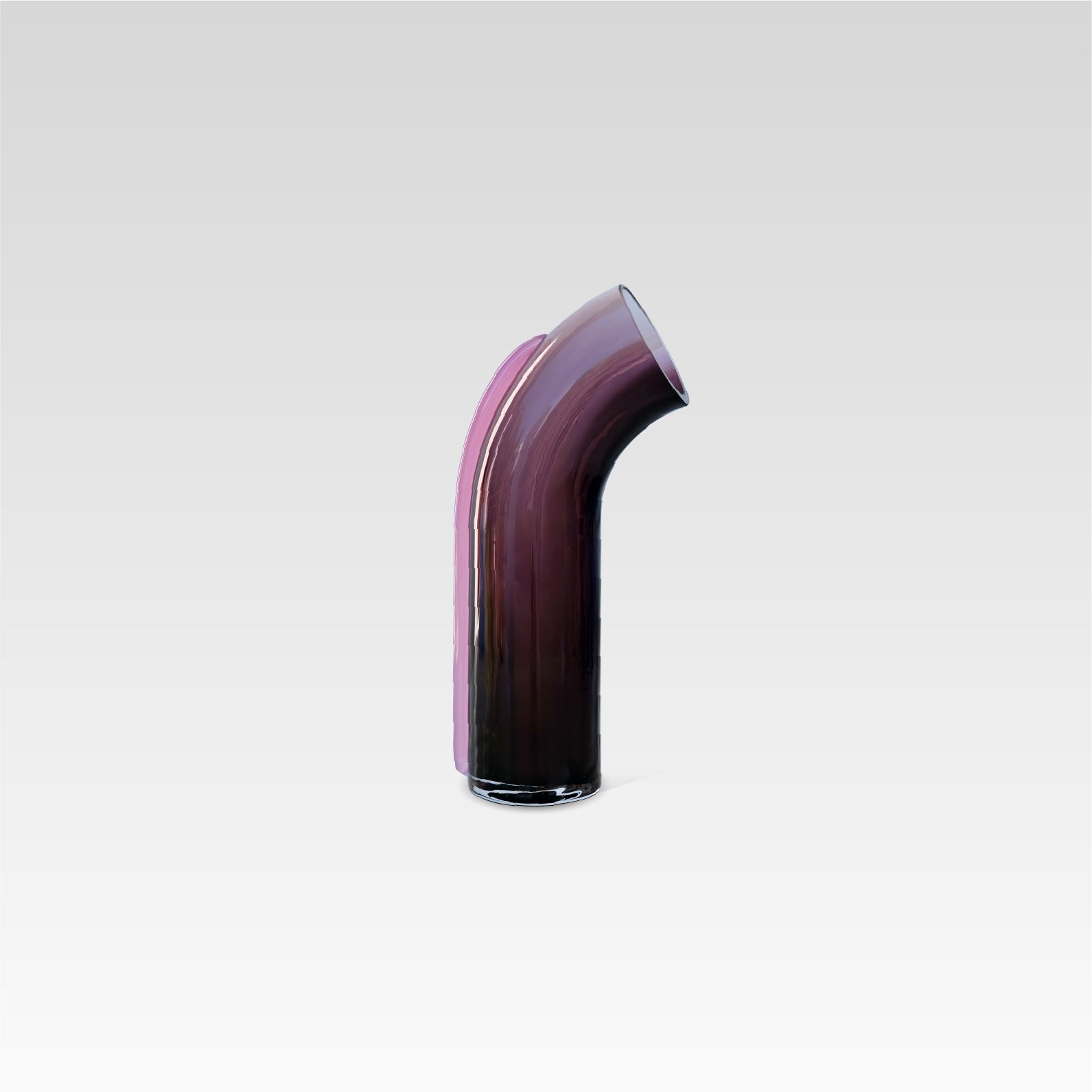 Dark purple glass cylinder with a slight arc on top, with an opening at the top, a light pink strip of glass connected to the back of the vase, on a white background