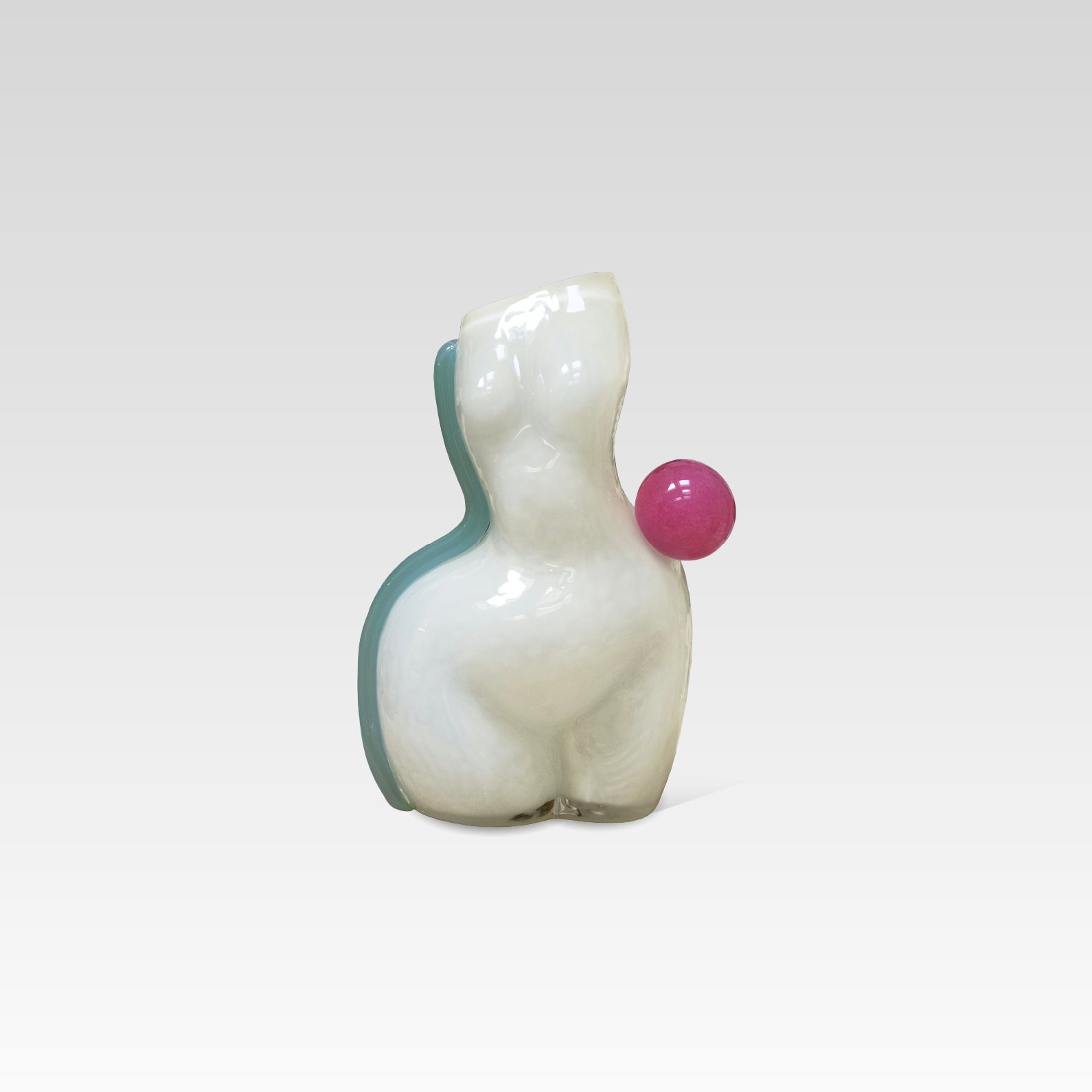White womans figure made of glass with a light blue stripe on the left and a pink ball on the right waist, on a white background