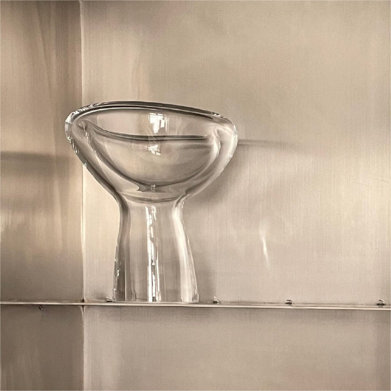 Clear glass bowl on a metallic surface
