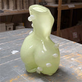 Futura cloud limoncello glass vase with bubble-like dots, positioned on a wooden surface