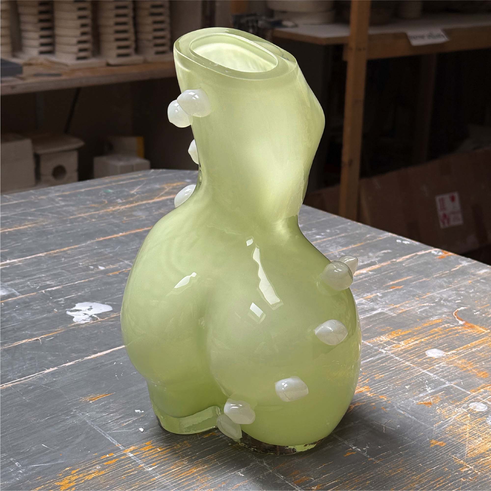 Futura cloud limoncello glass vase with bubble-like dots, positioned on a wooden surface