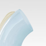 Close up of the soft blue Nessie with a white background.