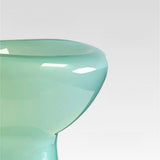 Close-up of a teal chair with a white background