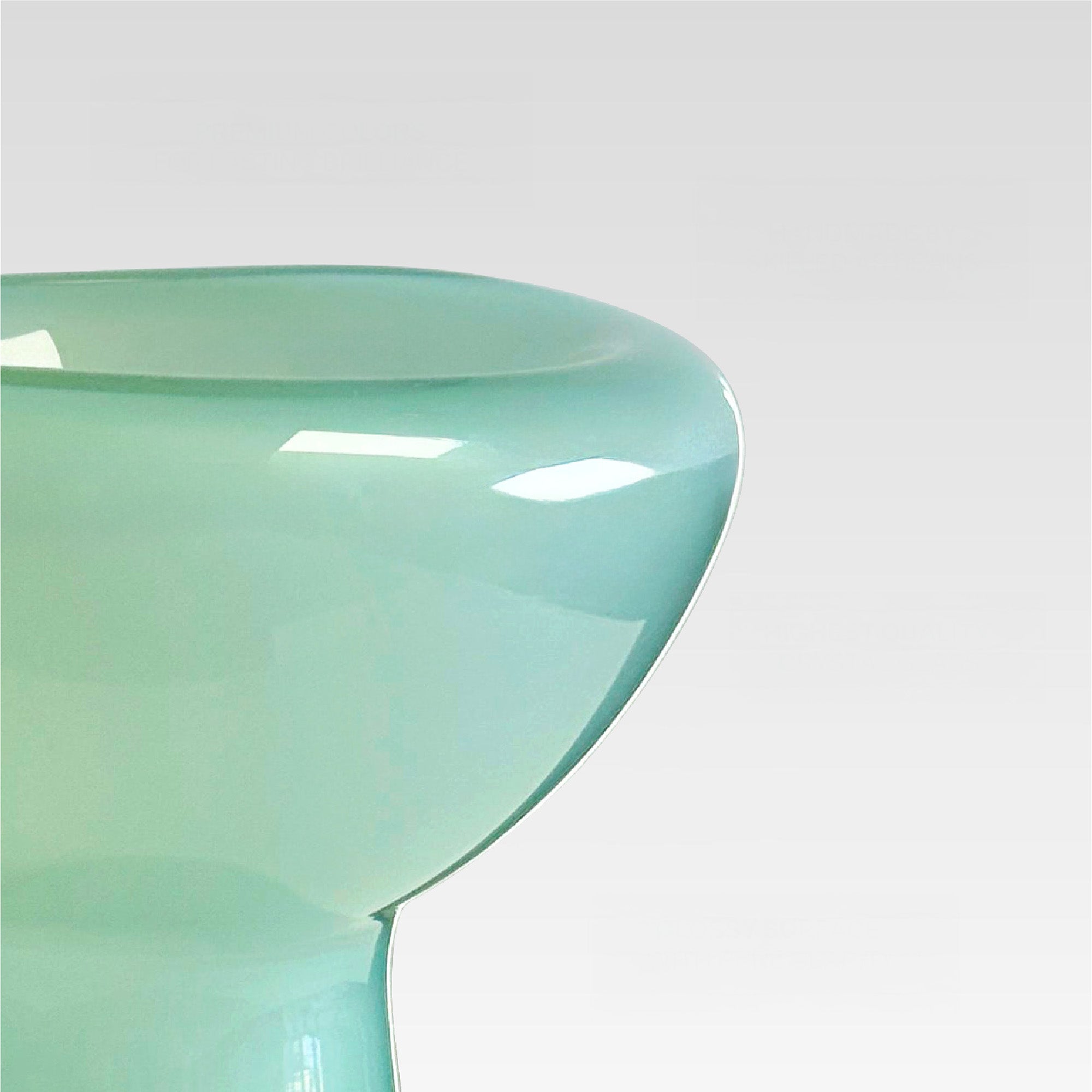Close-up of a teal chair with a white background