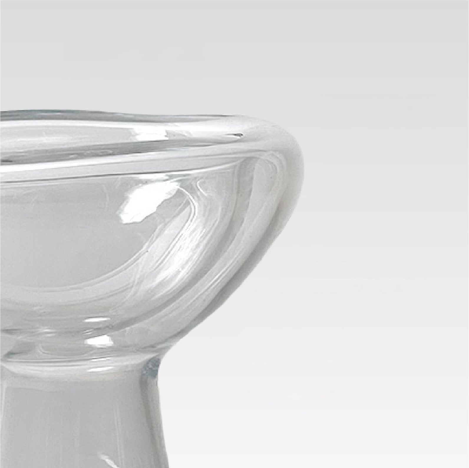 Clear glass bowl on a light gray background