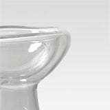 Clear glass bowl on a light gray background