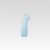 Soft blue nessie with a vanilla stripe on the back, curved object, on a light gray background.