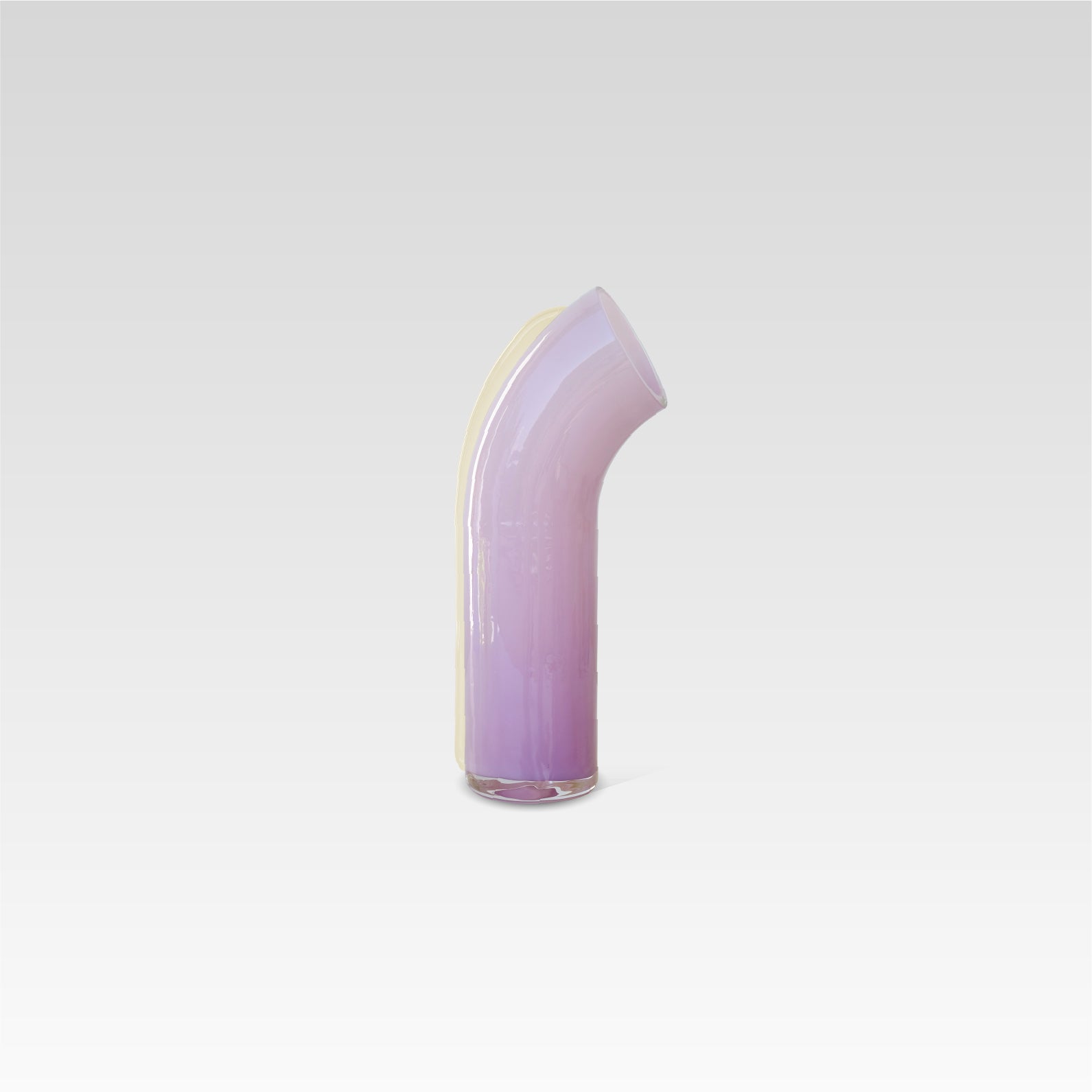 Side view of the soft pink Nessie Carafe with a white strip on the back