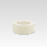 A medium-sized, handmade vanilla white glass bowl with a curved shape, displayed against a neutral background.