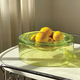 Wetbowl lime filled with lemons, positioned in a warm sunlit room on top of a moving tray table. 