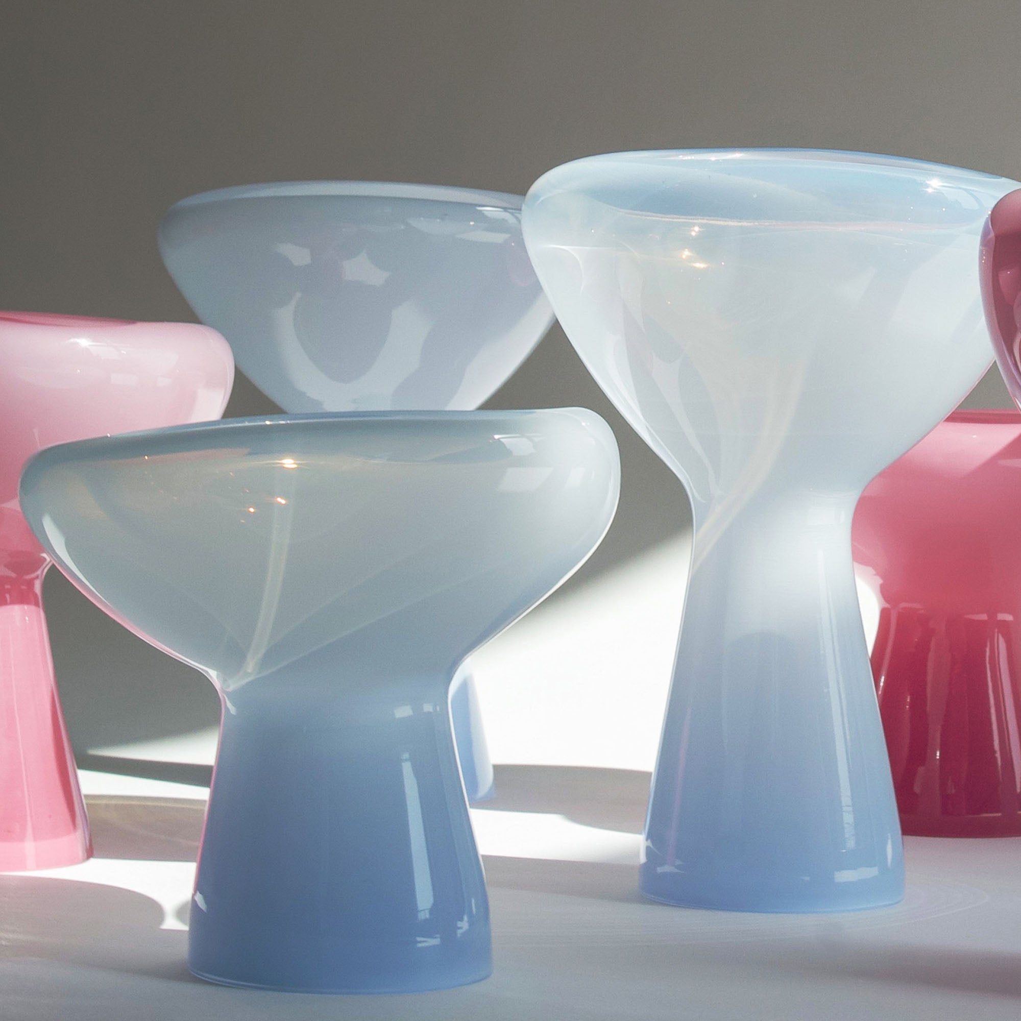 Set of colorful plastic phantom dishes with a modern design on a neutral background
