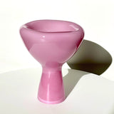 Pink glass bowl on a white background